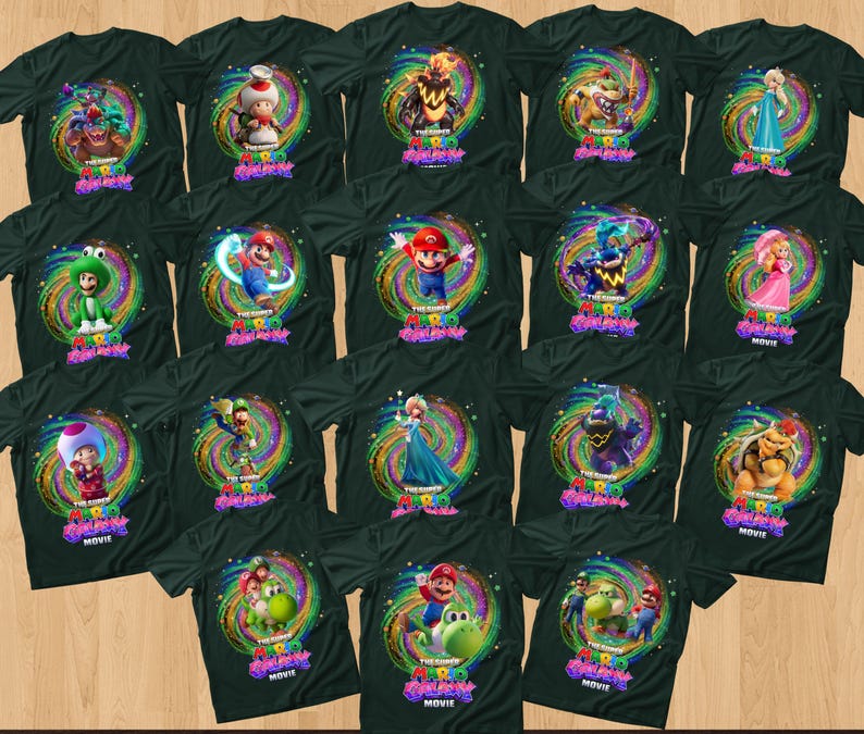 May include: A collection of black t-shirts featuring various characters from The Super Mario Bros. Movie, including Mario, Luigi, Peach, Toad, and Bowser, each set against a vibrant, swirling, multi-colored cosmic background with the movie logo.