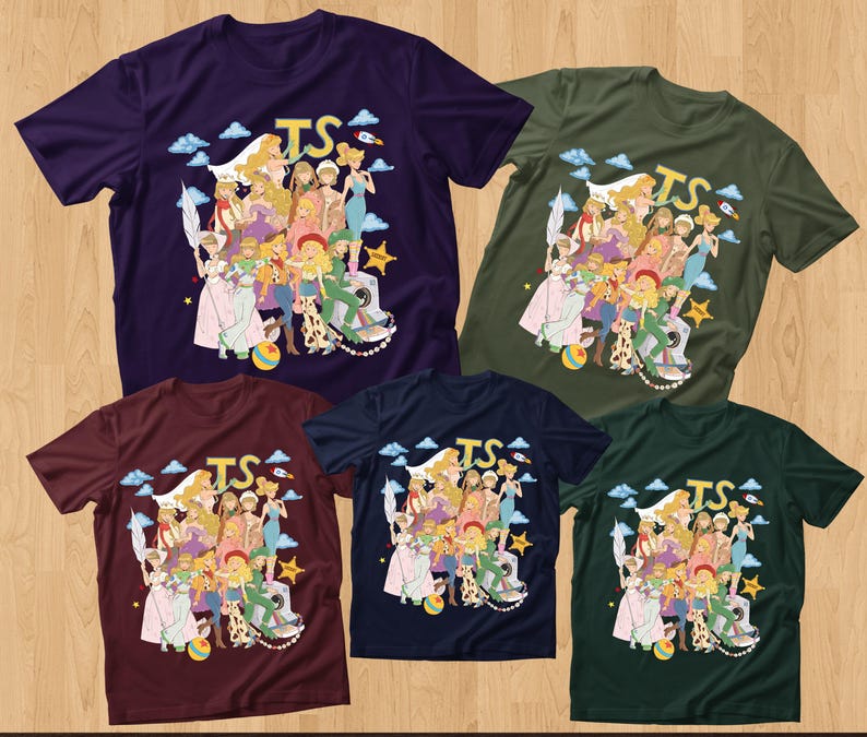 May include: Five short-sleeved crew neck t-shirts in dark purple, olive green, maroon, navy blue, and dark forest green. Each shirt features a central graphic illustration of various animated characters, the letters TS, clouds, a rocket, and a star.