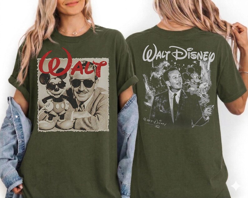 May include: An olive green t-shirt featuring a front graphic of Walt Disney and Mickey Mouse wearing sunglasses with the red text Walt above them, and a back graphic of Walt Disney in a suit with the text Walt Disney printed in white script.