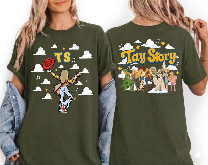 May include: An olive green t-shirt featuring a graphic print. The front displays a figure with a guitar, a red hat, and the text TS amidst white clouds. The back shows a group of illustrated figures and the text Tay Story with clouds.