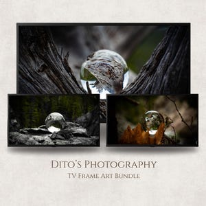 May include: A TV frame art bundle with three nature-inspired images. Each image presents a clear glass sphere reflecting natural elements such as wood and foliage. The images are displayed on black TV frames, offering a contemporary look.