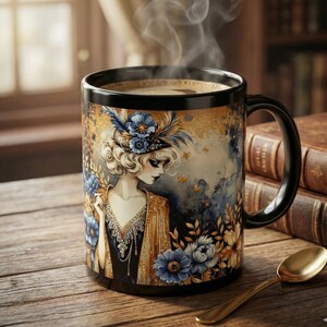 May include: Black coffee mug with a vintage illustration of a woman in a flapper-style dress and floral accents. The mug has a black handle and rim, with a gold spoon resting on a wooden surface.