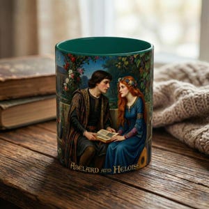 May include: A teal ceramic mug with a romantic painting of a couple reading a book under a floral arch. The artwork depicts a man and woman in medieval attire. The mug has the text "Abelard and Heloise" at the bottom.