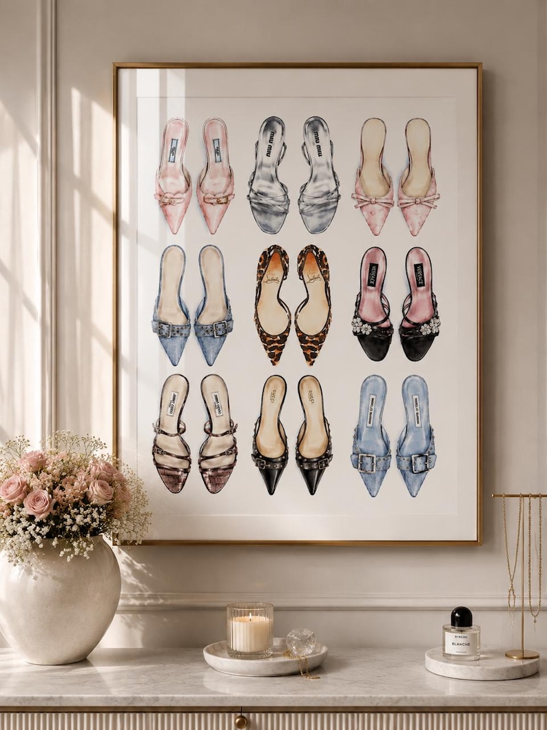 May include: A framed wall art print featuring a grid of eighteen illustrated high-heeled mules in various colors and textures, including pink, silver, leopard print, black, and blue, arranged in three rows of three pairs against a white background.