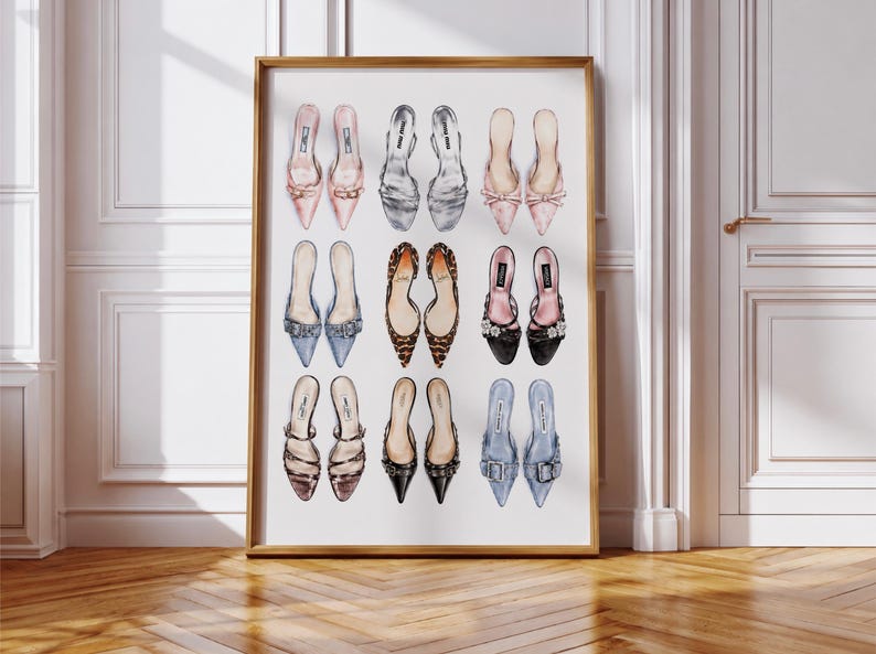 May include: A framed wall art print featuring a grid of nine pairs of illustrated high-heeled shoes in various colors and textures, including pink, silver, leopard print, black, and blue, arranged in three rows against a plain white background.