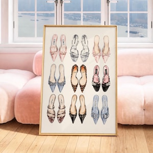 May include: A framed wall art print featuring a grid of nine pairs of illustrated high-heeled shoes in various colors and styles, including pink, silver, leopard print, black, and blue, arranged in three rows against a light cream background.