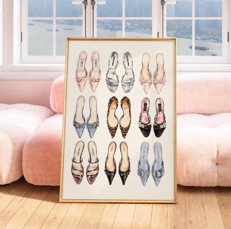 May include: A framed wall art print featuring a grid of nine pairs of illustrated high-heeled shoes in various colors and styles, including pink, silver, leopard print, black, and blue, arranged in three rows against a light cream background.