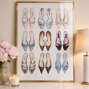 May include: A framed wall art print featuring a grid of nine pairs of illustrated high-heeled mules in various colors and textures, including pink, silver, leopard print, black, and blue, displayed against a plain white background.