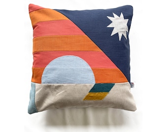 Stripe and star patchwork and appliqué patterned cushion in navy, orange & coral