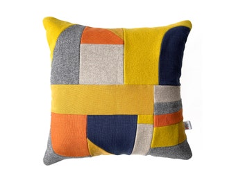 Geometric 'Collage' patchwork cushion in Grey, navy, mustard & teal