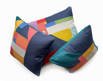 Bright multi coloured geometric patterned patchwork cushions