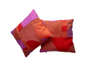 Bright pink and red patterned patchwork cushions