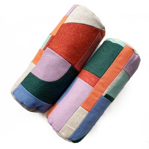 Landscape patchwork bolster cushions in mauve, orange, mint and green