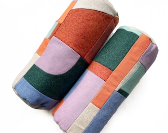 Landscape patchwork bolster cushions in mauve, orange, mint and green