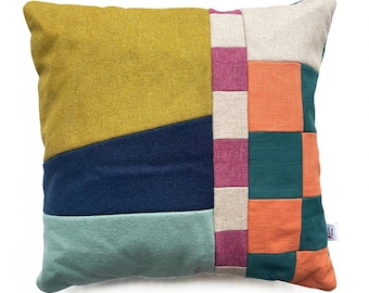 Square and stripe patterned patchwork cushions