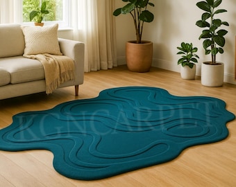 Deep Teal Contoured Rug: Hand Tufted Wool Organic Shape, Sculptural Relief, and Modern Design. Perfect statement piece for a tranquil space.
