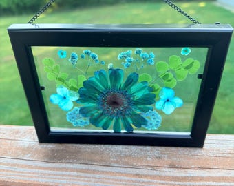 Obra de arte con flores prensadas