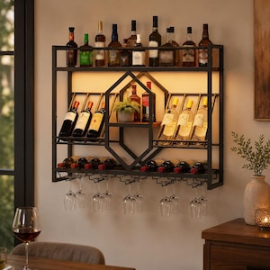 May include: A black metal wall-mounted wine rack featuring three tiers for bottle storage, a central hexagonal decorative frame, and a bottom row of hanging racks for stemware. The unit includes integrated warm lighting and holds multiple bottles.