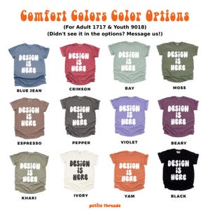 May include: A range of Comfort Colors t-shirts in colours such as blue jean, crimson, bay, moss, espresso, pepper, violet, beary, khaki, ivory, yam, and black. Each shirt has the text "DESIGN IS HERE".