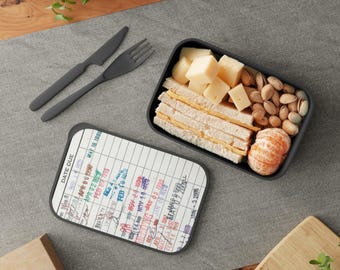Fiambrera/contenedor para el almuerzo con tapa y utensilios, con sello de la tarjeta de la biblioteca.