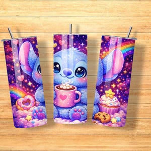 May include: Three stainless steel tumblers with a cartoon character design. The design features a blue creature holding a pink mug with a heart, a rainbow, and a cupcake. The tumblers are decorated with hearts, stars, and a galaxy background.