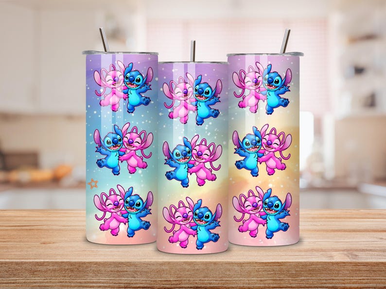 May include: Three stainless steel tumblers with a colorful design featuring the characters Stitch and Angel from Lilo & Stitch. The tumblers have a gradient background of blue, pink, and yellow. Each tumbler has a silver straw.