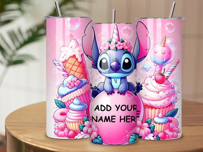 May include: Pink insulated tumbler featuring a cartoon character with a unicorn horn, surrounded by cupcakes, ice cream cones, and bubbles. The tumbler has a silver straw and the text "ADD YOUR NAME HERE" on a pink bubble.