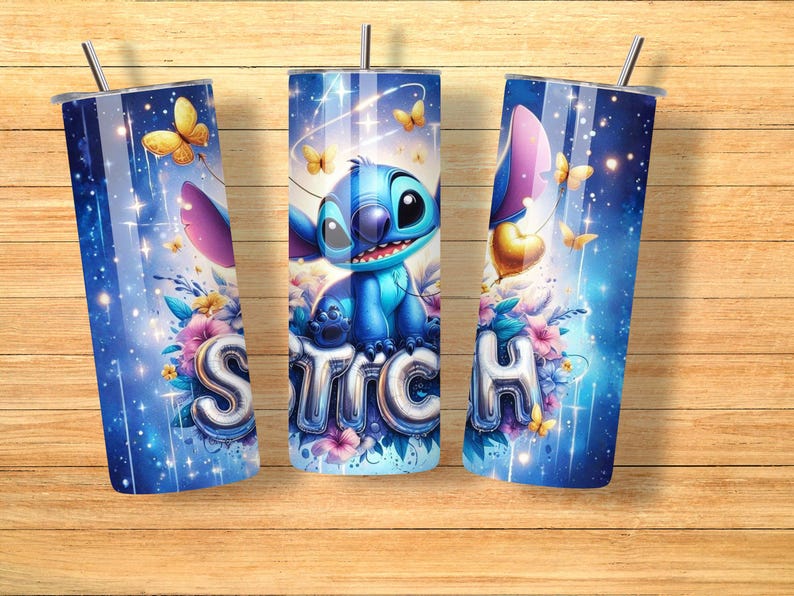 May include: Three blue tumblers with a Stitch design. The design features the character Stitch, butterflies, and the word "Stitch" in a bubble font. The tumblers have a silver straw and lid, set against a blue background with floral accents.