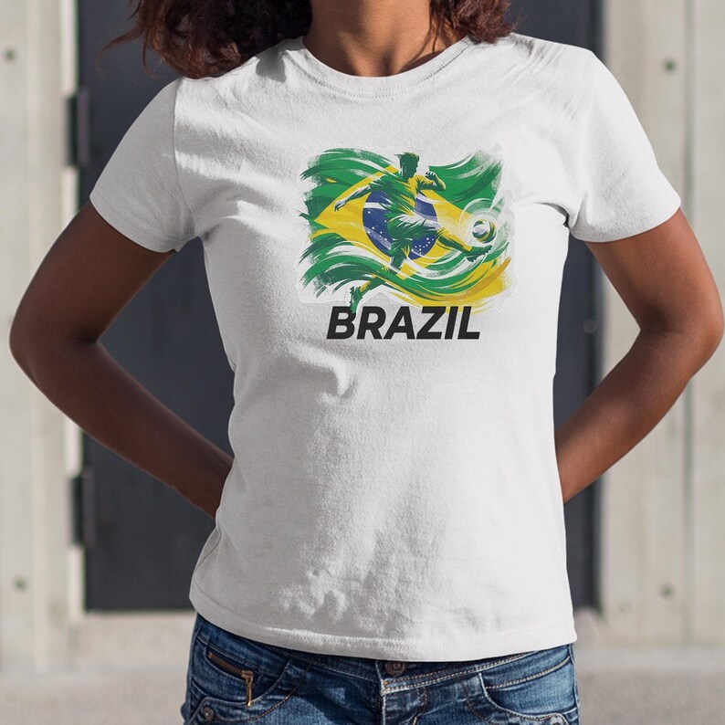 A white t-shirt with a graphic design of a soccer player and the word "BRAZIL" printed on it.