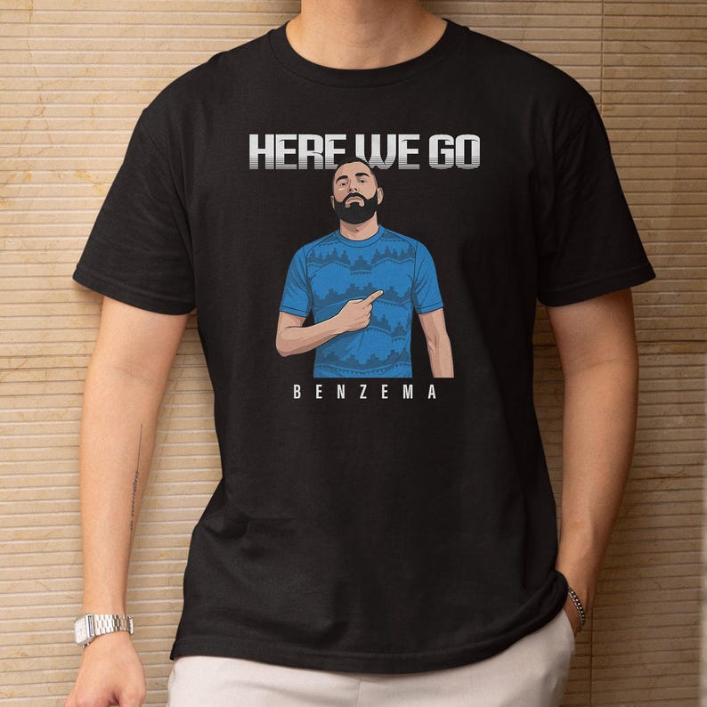 a man wearing a black t-shirt with a graphic design and text printed on it.