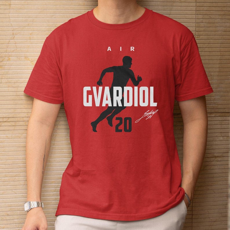 A red t-shirt with a graphic design featuring a silhouette of a person running and the text "AIR GVARDIOL 20" printed on it.