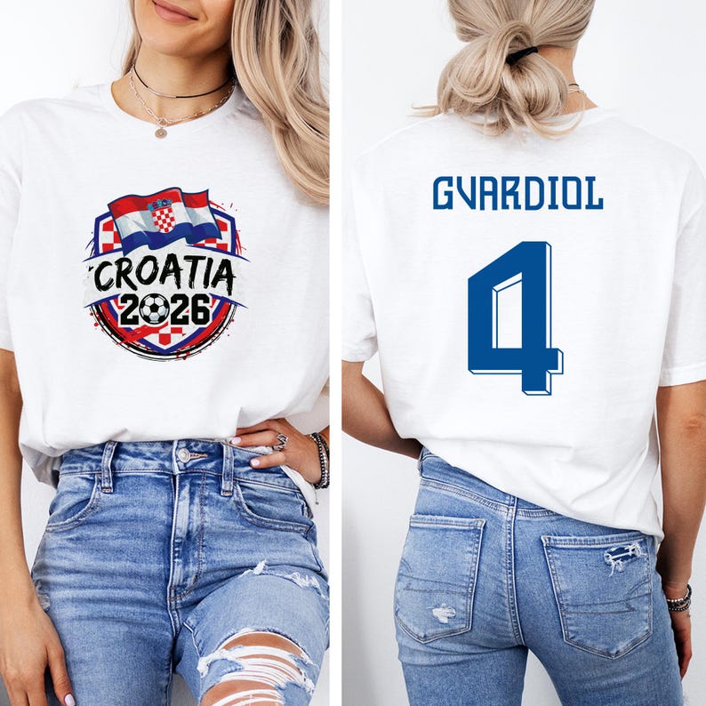 A woman wearing a white t-shirt with a graphic design and the text "CROATIA 2026" printed on it, along with the number "4". She is also wearing blue jeans.