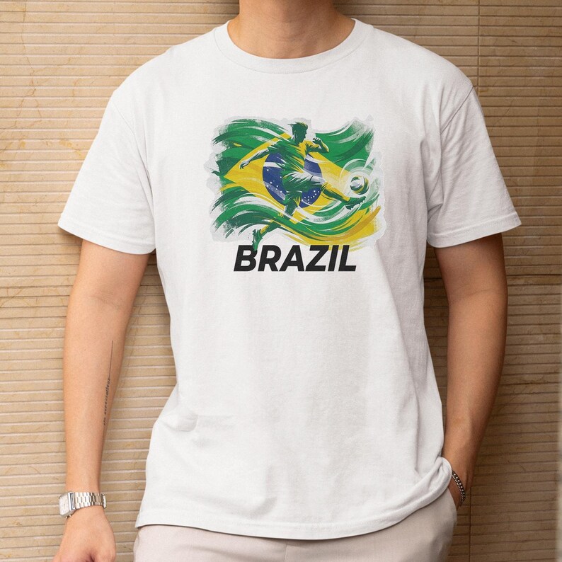 A white t-shirt with a graphic design of the Brazilian flag and the word "BRAZIL" printed on it.