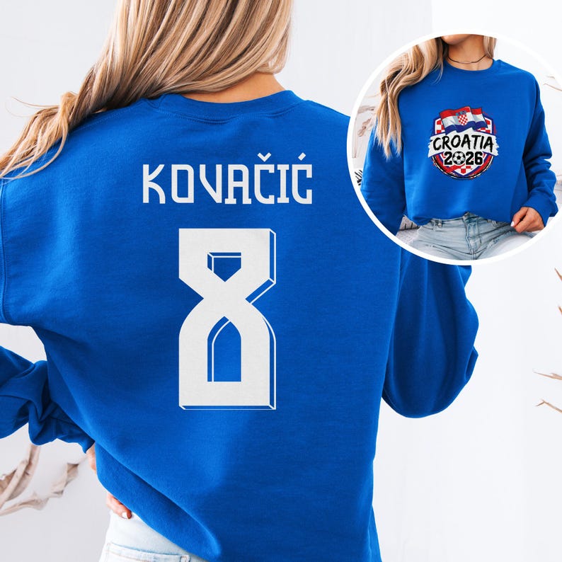 A woman wearing a blue sweatshirt with the name 'Kovacic' and the number 8 printed on it.