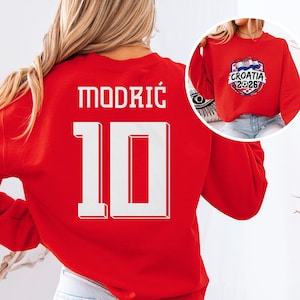 A red sports jersey with the number 10 and the name "Modric" printed on it.