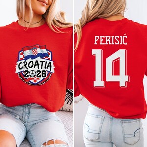 A red shirt with a graphic and text related to the Croatia soccer team, and a number on the back.