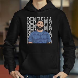 A black hoodie with a graphic design featuring a man with a beard wearing a blue shirt.