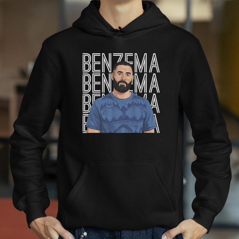 A black hoodie with a graphic design featuring a man with a beard wearing a blue shirt.