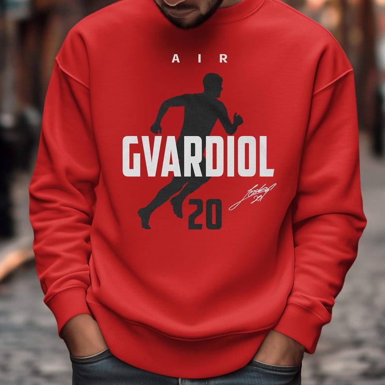 A man wearing a red sweatshirt with a graphic design on it.