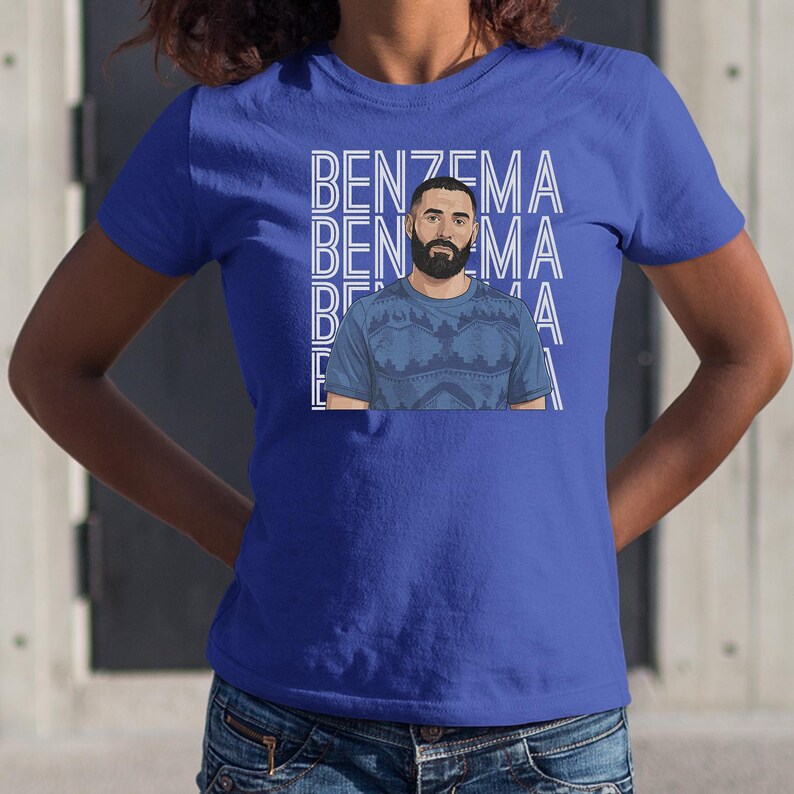 A person wearing a blue t-shirt with a graphic of a man and the text "BENZEMA" repeated across the shirt.