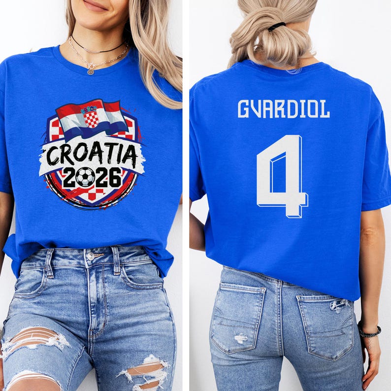 A woman wearing a blue t-shirt with a graphic of the Croatia national flag and the text "CROATIA 2026" printed on it.