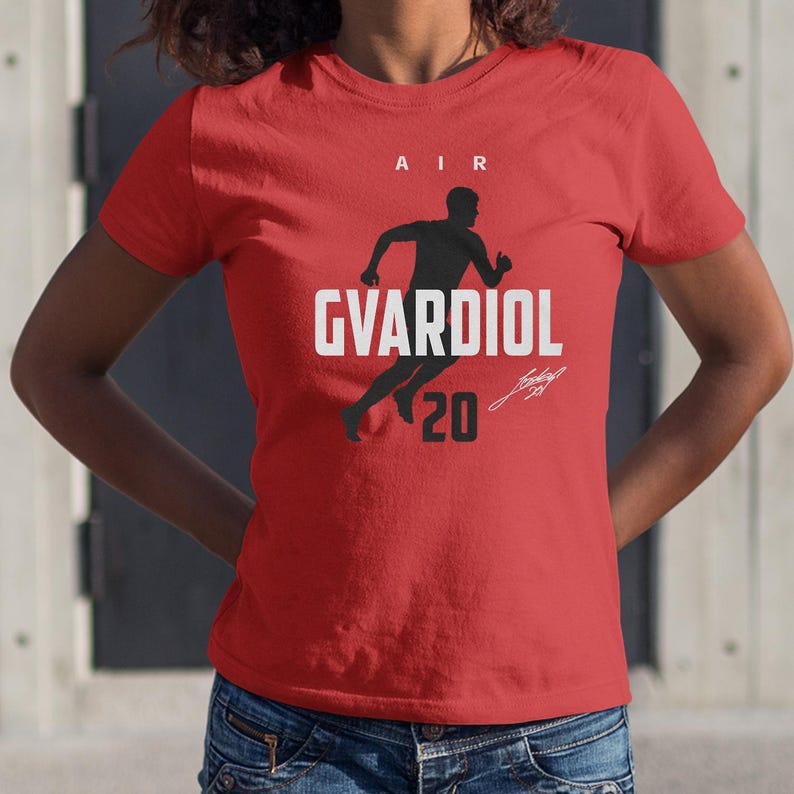 A red t-shirt with a graphic design and text printed on it.