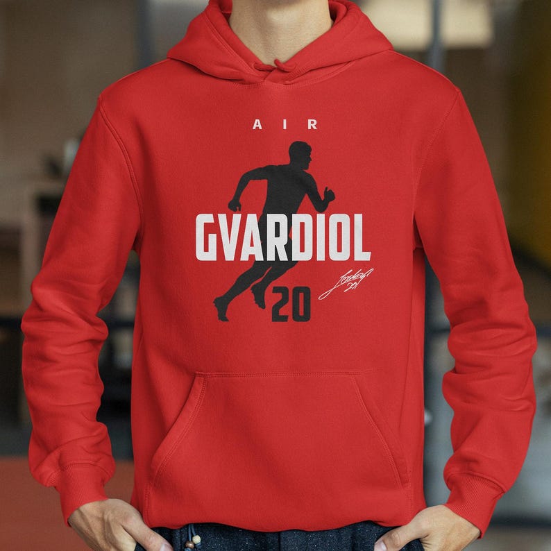 A red hoodie with a graphic design featuring a silhouette of a person running and the text "AIR GVARDIOL 20" printed on it.