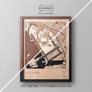 May include: A framed wooden map of John F. Kennedy International Airport in New York. The map is a detailed, layered design in shades of brown and black, with the airport layout clearly visible. The frame is a combination of brown and black. The text "ANY AIRPORT, CUSTOMIZED FOR YOU" is at the bottom.