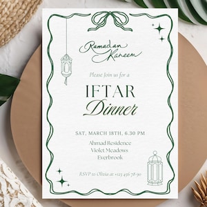 May include: An invitation for an Iftar dinner, featuring elegant calligraphy and decorative elements. The invitation is framed with a green border and includes the text "Ramadan Kareem" and details for the event, including the date, time, and location.