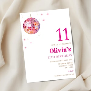 May include: A white invitation card with a pink disco ball illustration and the number 11. The text reads "Olivia's 11th Birthday" with event details. Pink star accents and gold text complete the design.