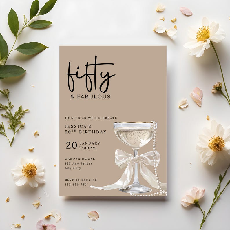 May include: A beige birthday invitation with the words "fifty & fabulous" in black script. A champagne glass with a white bow and pearl accents is featured. The invitation includes details for Jessica's 50th birthday on January 20th.