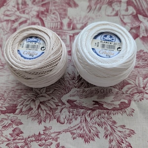DMC Cebelia spool of white and ecru yarn – 100% mercerized cotton Scottish yarn, size 20 and 10, for crochet lace and finishing.