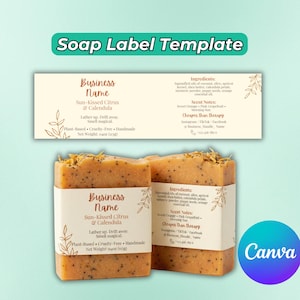 May include: Two bars of handmade soap with labels. The labels read "Sun-Kissed Citrus & Calendula" and list ingredients and scent notes. The soap is a light orange color with visible seeds and dried flower petals.