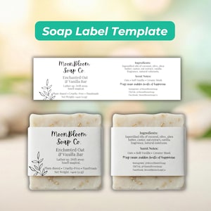 May include: Two bars of handmade soap with white labels. The labels read "MoonBloom Soap Co. Enchanted Oat & Vanilla Bar." The soap is plant-based, cruelty-free, and handmade, weighing 113g. The label also lists ingredients and scent notes.